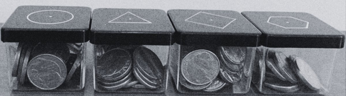 Four Practice boxes filled with evidence coins
